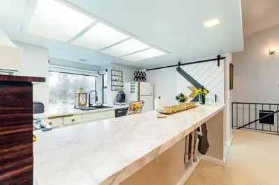 a large kitchen with a large marble counter top at Forest Creek 26 in Mammoth Lakes