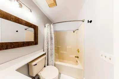 a bathroom with a shower and a toilet and a sink at Forest Creek 26 in Mammoth Lakes
