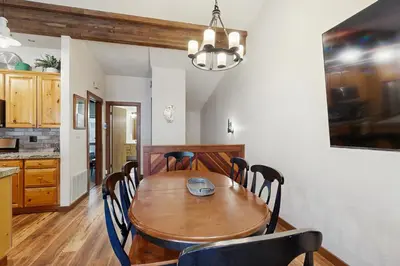 a dining room with a wooden table and chairs at Private Beach Retreat in Zephyr Cove