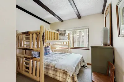 a bedroom with a bunk bed in a room at Private Beach Retreat in Zephyr Cove