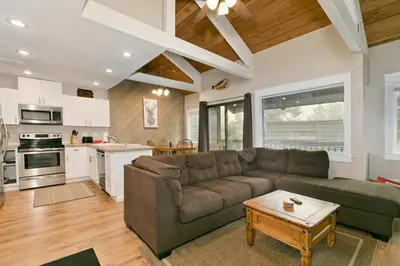 a living room with a couch and a table at Bigwood 32 in Mammoth Lakes