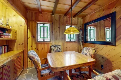 a dining room with a wooden table and chairs at Tahoe Delight in Tahoe City