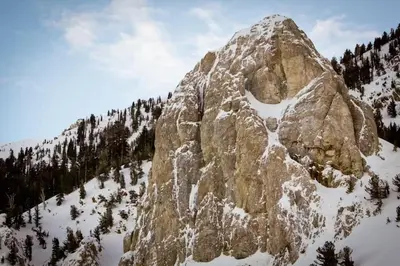 a large rocky mountain with snow on it at Mammoth Ski & Racquet 93K in Mammoth Lakes
