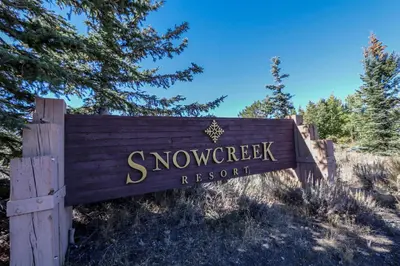 a sign for the snow sweepstakes resort at Snowcreek #760 condo in Mammoth Lakes