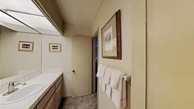 a bathroom with a sink and a mirror at Fantastic 3 Bedroom Condo with Great Views in Mammoth Lakes