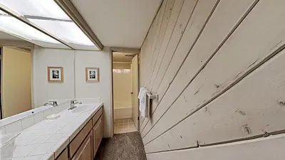 a bathroom with a large wooden sliding barn door at Fantastic 3 Bedroom Condo with Great Views in Mammoth Lakes