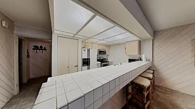 a kitchen with a long counter in a room at Fantastic 3 Bedroom Condo with Great Views in Mammoth Lakes