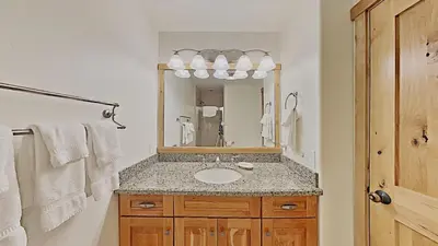 a bathroom with a sink and a mirror at Spacious Two Bedroom Condo with Loft! in Mammoth Lakes