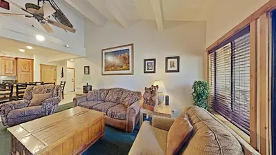 a living room with a couch and a coffee table at Spacious Two Bedroom Condo with Loft! in Mammoth Lakes