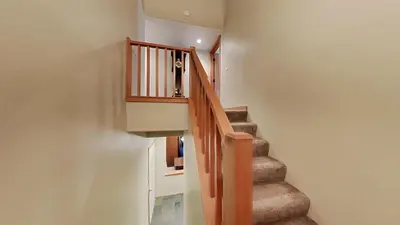 a staircase in a house with a stair case at Beautifully Remodeled 4 Bedroom Home in Mammoth Lakes