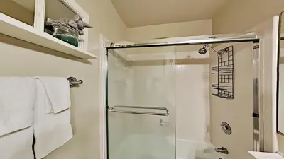 a shower with a glass door in a bathroom at Beautiful Remodeled One Bedroom Condo! in Mammoth Lakes