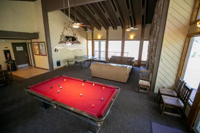 a room with a red pool table in it at Beautiful Remodeled One Bedroom Condo! in Mammoth Lakes