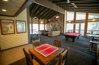a room with a ping pong table and a pool table at Spacious One Bedroom Condo with Full Kitchen! in Mammoth Lakes