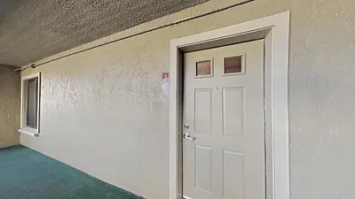 an empty room with a white door and a ceiling at Updated 2 Bdrm Condo with Shared Hot Tub in Mammoth Lakes