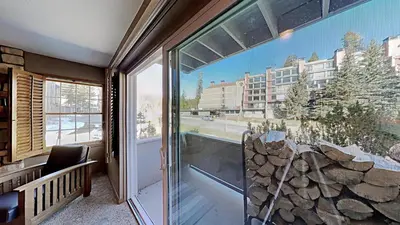 a room with a large window with a view of a building at Remodeled 2 Bedroom Condo withFull Kitchen! in Mammoth Lakes
