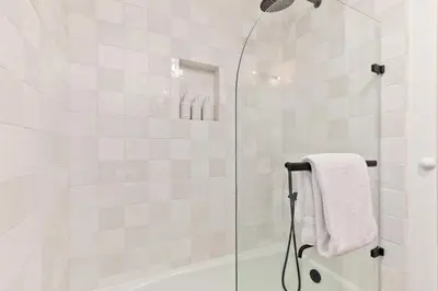 a bathroom with a shower with a glass door at Villa de los Pinos 42 in Mammoth Lakes