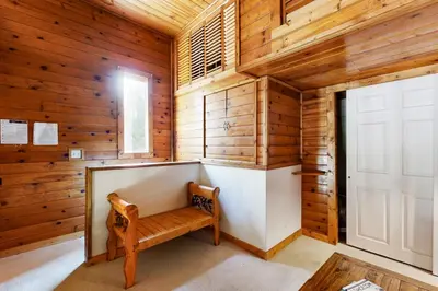 a wooden room with a bench and a door at Kings Run Relaxation in Kings Beach