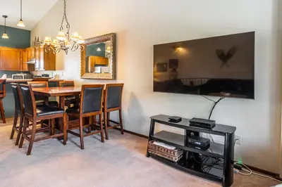 a kitchen and dining room with a table and chairs at Helios S # 5 in Mammoth Lakes