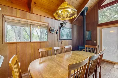 a dining room with a wooden table and chairs at Allen Edgewater Retreat in Groveland
