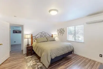 a bedroom with a large bed and a window at Holiday Chalet in Groveland