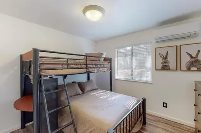 a bedroom with a bunk bed in a room at Holiday Chalet in Groveland