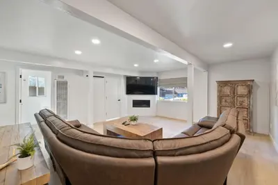 a living room with a large couch and a table at South Lake Chalet by Heavenly in South Lake Tahoe
