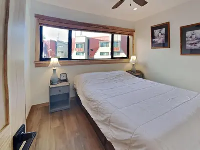 a bedroom with a bed and a window at Spacious 3 BR Condo with Loft in Mammoth Lakes