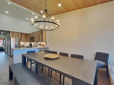 a dining room with a table and chairs at Spacious 3 BR Condo with Loft in Mammoth Lakes