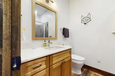 a bathroom with a sink and a toilet and a mirror at Truckee Treat in Truckee