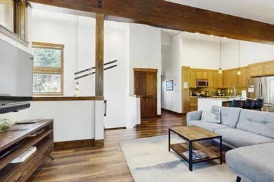 a living room with a couch and a table at Truckee Treat in Truckee