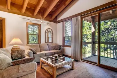 a living room with a couch and a table at Less Than 1 Mile to Northstar Resort Getaway with Balconies in Truckee