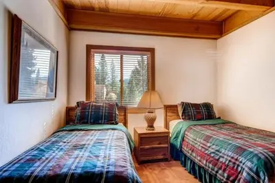 a bedroom with two beds and a lamp on a table at Less Than 1 Mile to Northstar Resort Getaway with Balconies in Truckee