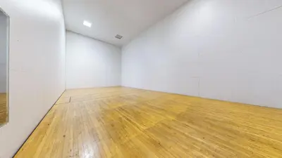 an empty room with a wooden floor and white walls at Helios North #6 condo in Mammoth Lakes