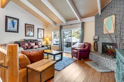 a living room with a couch and a fireplace at Linda's Lakehouse in Incline Village