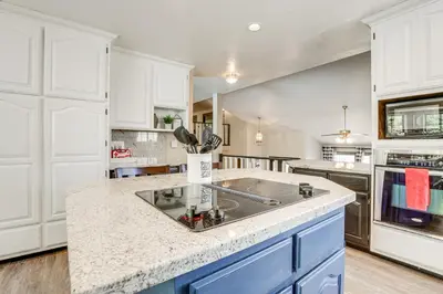 a kitchen with white cabinets and a counter top at Pet-Friendly Jackson Wine Country Home with Pool! in Jackson