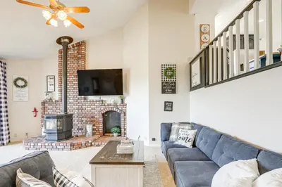 a living room with a couch and a fireplace at Pet-Friendly Jackson Wine Country Home with Pool! in Jackson
