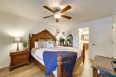 a bedroom with a bed with a ceiling fan at Snowcreek Resort Condo with Deck at Mammoth Mountain in Mammoth Lakes