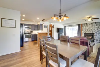 a dining room and kitchen with a table and chairs at Snowcreek Resort Condo with Deck at Mammoth Mountain in Mammoth Lakes