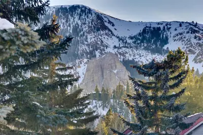 a view of a mountain with trees in the foreground at Snowcreek Resort Condo with Deck at Mammoth Mountain in Mammoth Lakes