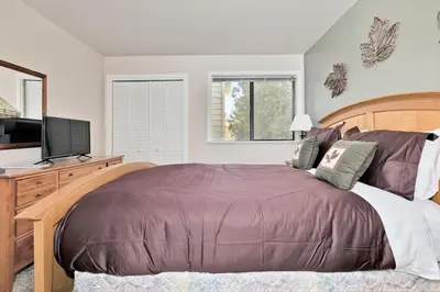a bedroom with a large bed and a television at La Vista Blanc 78 in Mammoth Lakes