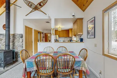a kitchen and dining room with a table and chairs at Poma Lane in Soda Springs
