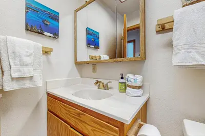 a bathroom with a sink and a mirror at Poma Lane in Soda Springs
