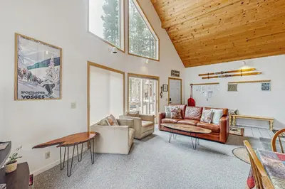a living room with a couch and a table at Poma Lane in Soda Springs