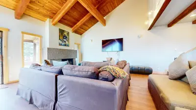 a living room with two couches and a fireplace at Val DIsere #10 condo in Mammoth Lakes