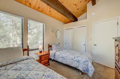 a bedroom with two beds and a window at Kings Beach Bliss in Kings Beach