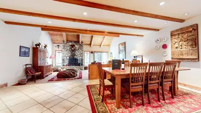 a living room with a wooden table and chairs at Val D'Isere #9 condo in Mammoth Lakes