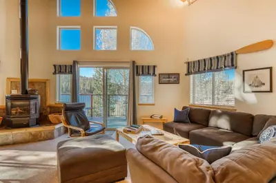 a living room with a couch and a fireplace at Boat House in Soda Springs