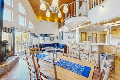 a dining room and kitchen with a table and chairs at Boat House in Soda Springs