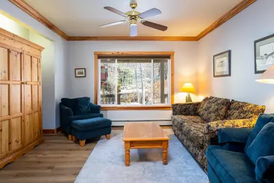 a living room with a couch and two chairs at Skidder Trail Family Lodge home in Truckee