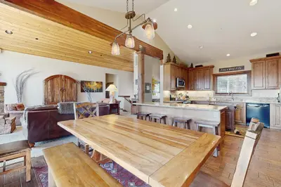 a kitchen with a wooden table in a room at Fabian Holidays in Tahoe City